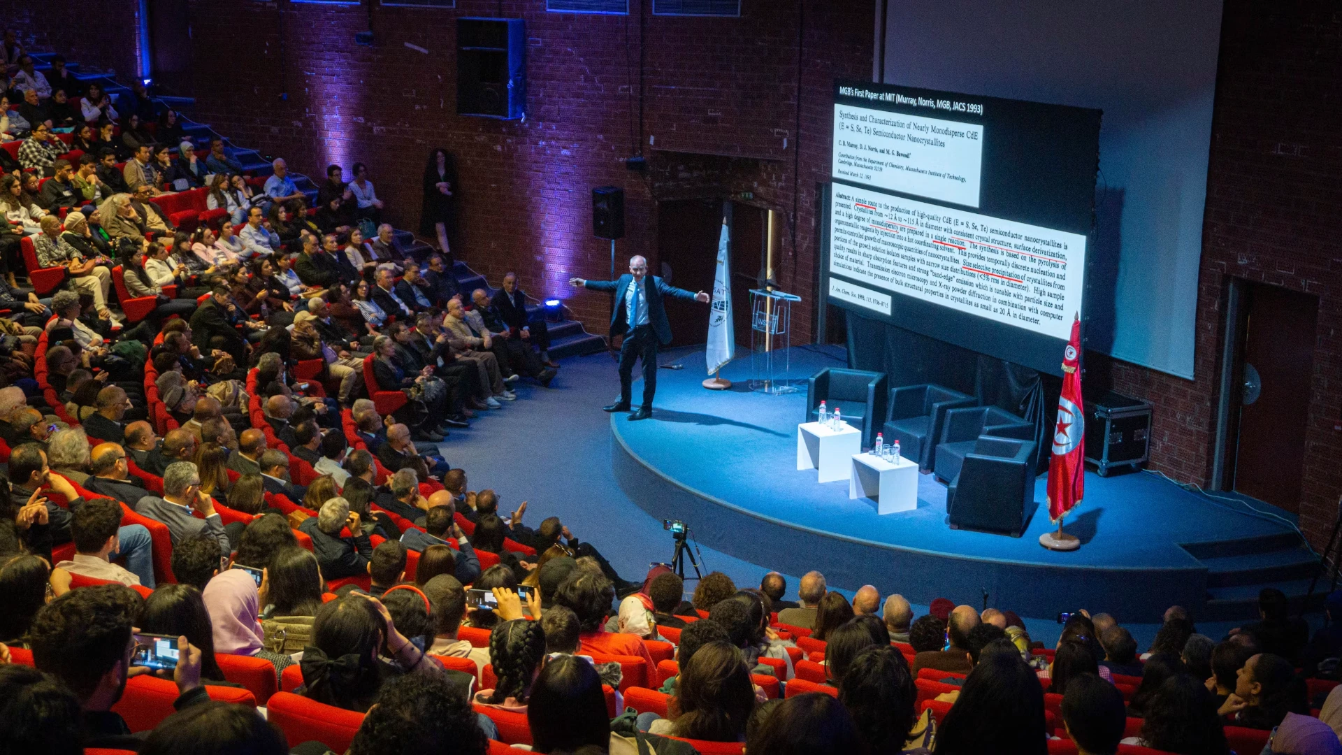 Leadership keynote speaker engaging a live audience